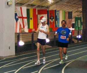 Justin Gillette and Doug Yoder neck and neck in the nations 3rd indoor marathon. Gillette surpassed Yoder and won the race. Photo contributed by Doug Yoder. Justin Gillette and Doug Yoder neck and neck in the nations 3rd indoor marathon. Gillette surpassed Yoder and won the race. Photo contributed by Doug Yoder.
