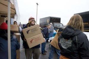 feedthechildren-web-christine-ludin Matt Plummer, a senior, hauls boxes at the Feed the Children event Tuesday. Photo by Christine Ludin.