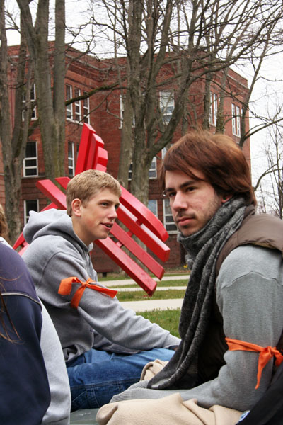 silent-vigil-web-trisha-handrich Chet Franklin (right) and Billy Funk helped organize the silent vigil in protest of Goshen College's discriminatory hiring policy. Photo by Trisha Handrich.