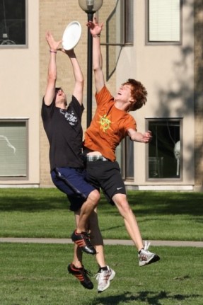 ultimate Micah Kulp and Abe Stuckey vie for the disc in a recent pickup game with members of the Ultimate Fall League. Photo by Ryan Rittenhouse.