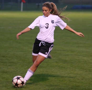 Brianne Mault, a forward, controlls the ball in a recent contest against the St. Francis cougars. The Leafs lost 3-nil.  Photo by Martin Burbaker.