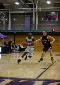 Mens_BBall-SID Daniel Butler jukes around an opponent in the Leafs' recent contest against Holy Cross. Photo provided by Sports Information Department.