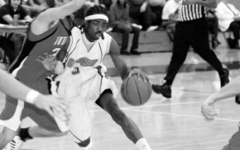 bball Errick McCollum, one of Goshen Basketball's star players, jukes around an opponent in the men's first game of the season. Photo provided by Sports Information Department.
