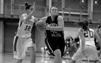 timthumb Erica Immanuel, left, attempts to slap the ball away from an opponent in the Leafs’ recent contest against Indiana University-Northwest. The Leafs won 62-50. Photo provided by the Sports Information Department.