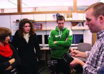 Students Hannah Sauder, junior, Elizabeth Derstine, junior and Dalton Shetler obvserve professor Seth Conley in class.