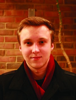 Dimitri Shendell, a first-year student from the Ukraine, poses in Java Junction during his break between classes.
