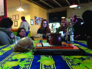Students Laura Miller and Maddie Gerig, sophomores join Ramona Whittaker, a first-year for lunch at Rachel's Bread after their trip to the farmer's market.