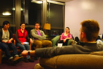 Resident Assistants Jacob Roth, Zachary Zimmerman, Anya Kreider and Chris Moon sit with Resident Director Leanna Teodosio during a resident life meeting.