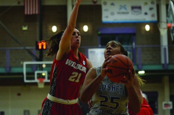 Keshia Ward, Junior, fends off a defender while going up for a shot during the Lady Leaf's last home match against Indiana Wesleyan University