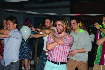 Minah Kim, Andre Eisenbeis, Isaiah Freisen and Timothy Bixler participate in in the Macarena during the 90's prom event from this weekend.