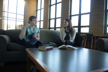Eliana Neufeld Basinger, a first-year, sits with Hannah Quast, the campus minister for the Catholic Diocese of Ft. Wayne-South Bend before a Catholic Communities meeting.