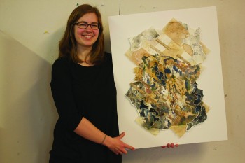 Kate Yoder, a senior art and English writing double major from Elkhart, models one of her pieces of artwork