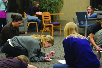 elly Miller, a senior, participates in a reflective exercise during the Conversations on Mental Health event on Tuesday night.