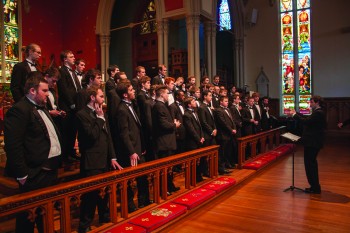 Senior Brody Thomas conducts the men in song on the Men’s Chorus spring break tour to New Orleans last week.