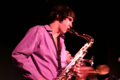 Jake Snyder plays the saxophone at a Kansas Bible Co. concert in Goshen