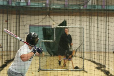 Baseball player practices batting