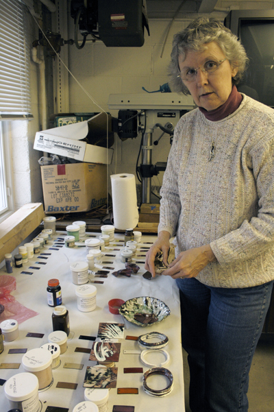 Judy Wenig-Horswell lays out beads and other materials for her jewelry class