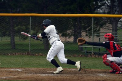 baseball player takes off running right after a hit