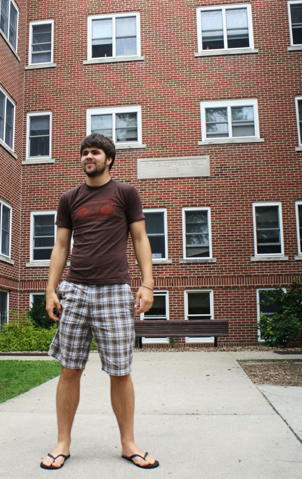 Josh Hertzler stands in front of Coffman Residence Hall