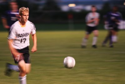 Soccer player chasing ball