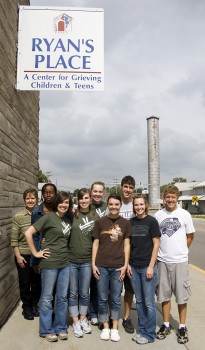 A group of friends living on the first floor of the Senior Appartments helped organize books, make pamphlets and clean out a storage shed at Ryan's Place. Photo by Emily Miller.