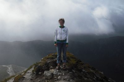 Sarah Rich stands on a cliff in Ireland