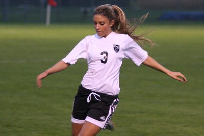 Mault kicking soccer ball