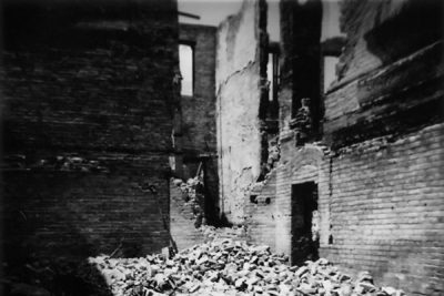 Emily Miller's black and white photo of an old, broken-down schoolhouse