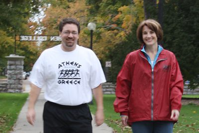 Bob and Pamela yoder walk on campus