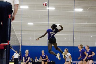 Peni jumps to spike volleyball