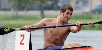 Austin Schwinn paddles down a river in a Barcelona world kayaking championship