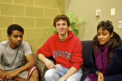 Three student researchers sit in armchairs in a Kratz connector