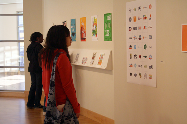 Students look at Mikey Burton's artwork in the Hershberger Art Gallery