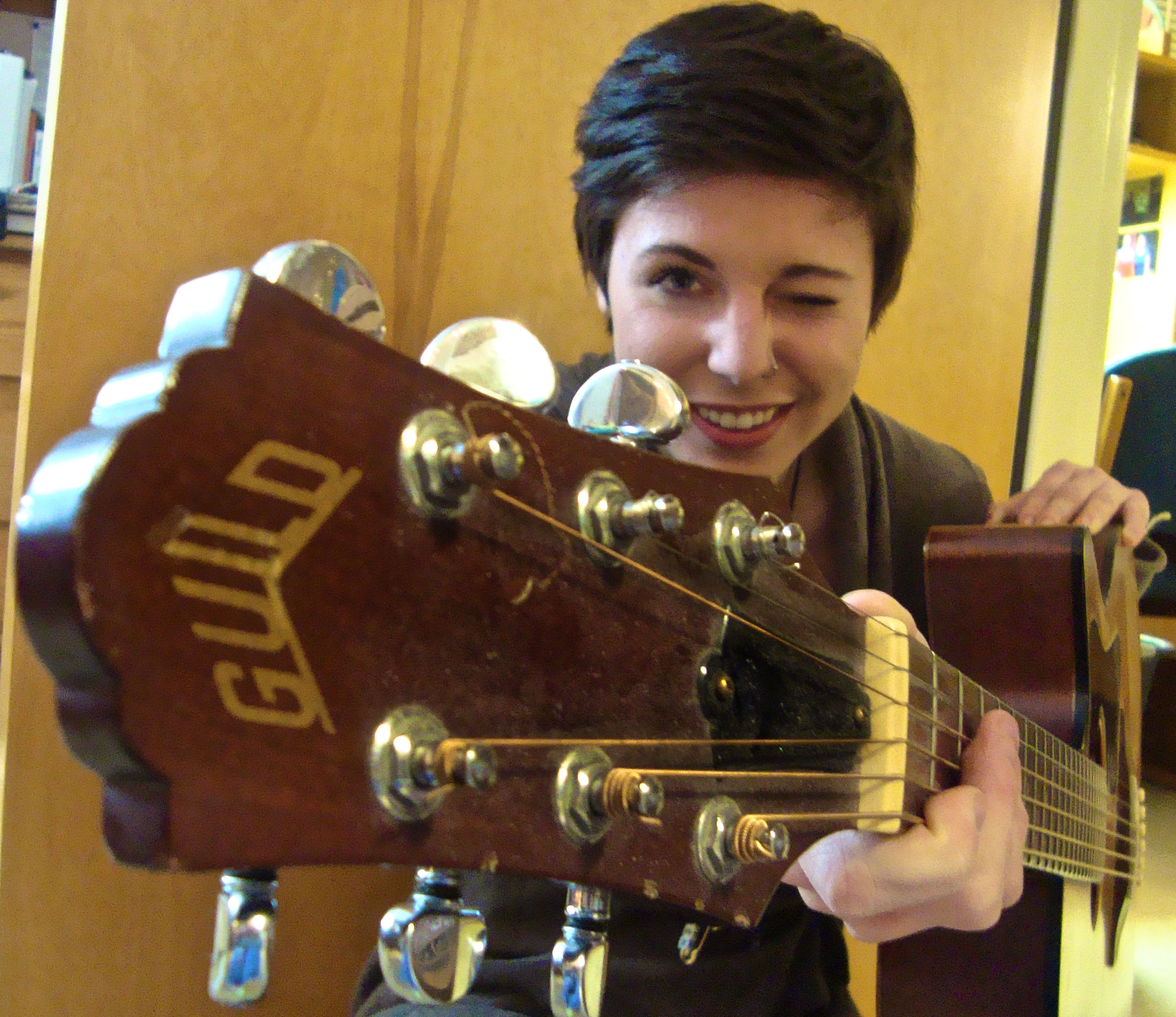 Lauren Treiber poses for a picture with her guitar
