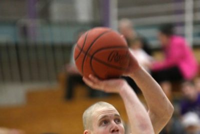 Close-up image of a player on the Goshen men's basketball team preparing to shoot