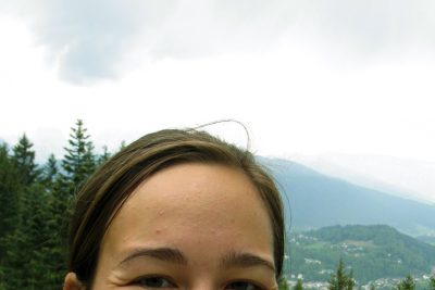 Selfie of Alison Reist on a mountaintop