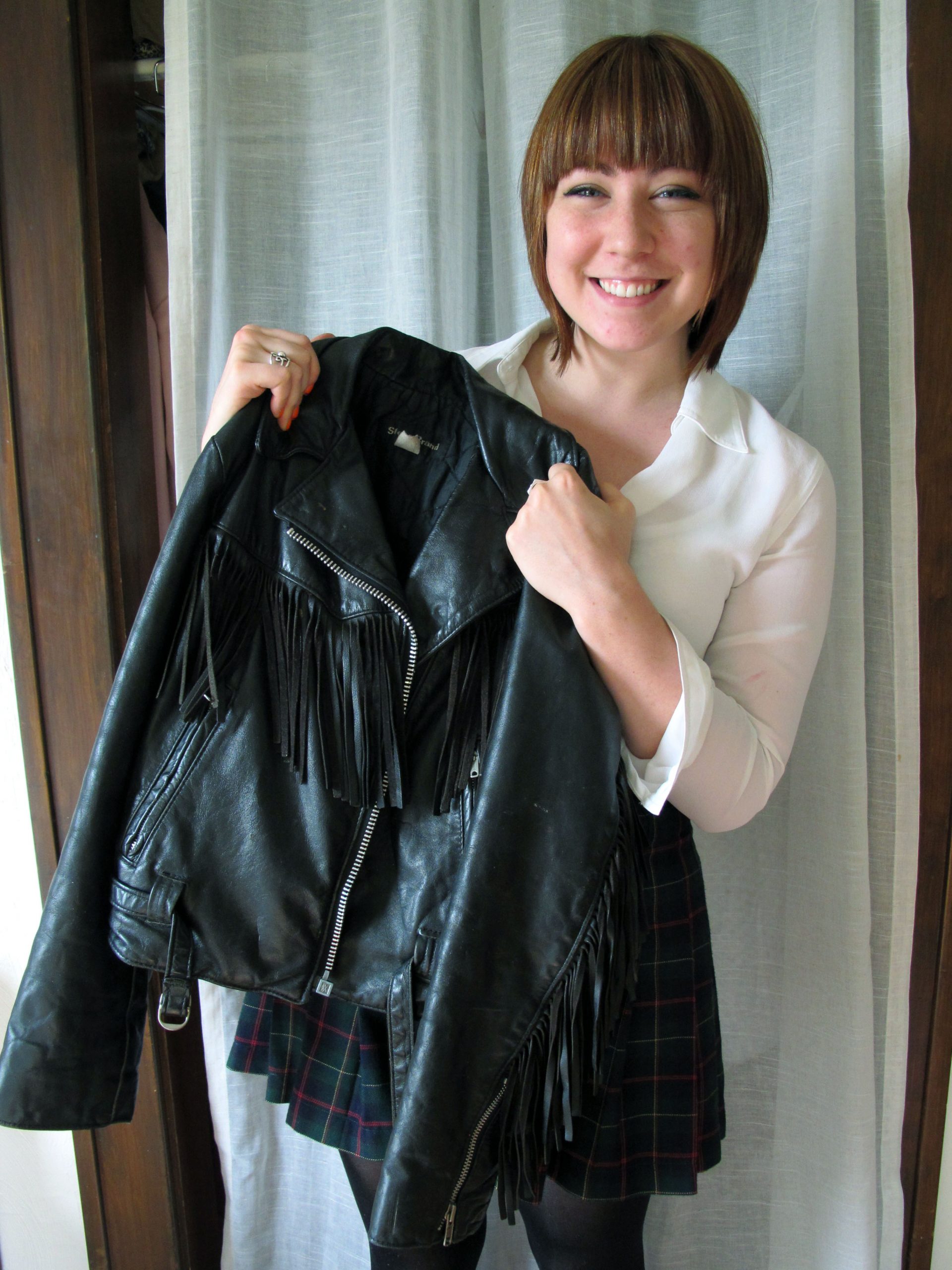 Devon Spitler shows off a jacket that she designed