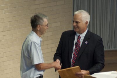 Kennard Martin shakes hands with President Brenneman