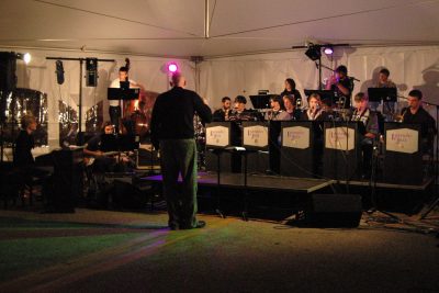 Lavender Jazz performs in a tent for First Friday