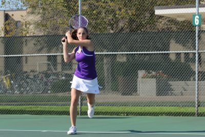 A player on the Goshen women's tennis team plays a game on the court