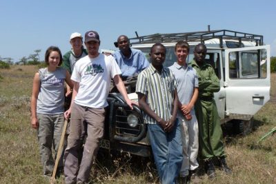 research group poses in Kenyan Savannah
