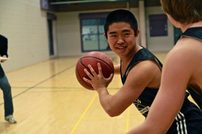 Minah Kim playing basketball