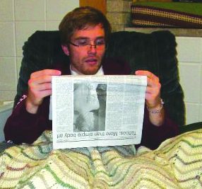 Senior student reading paper