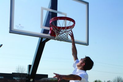 Nate Day dunks a basketball