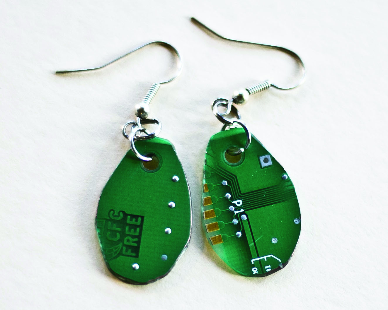 A pair of Ida Short's handmade earrings, made out of recycled PCB board