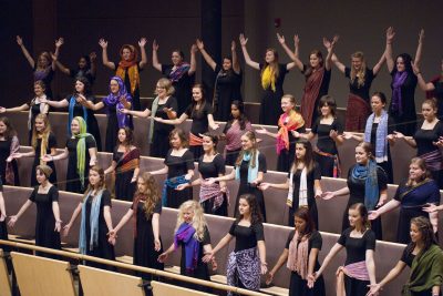Voices of the Earth sings in the choral balcony of Sauder Concert Hall