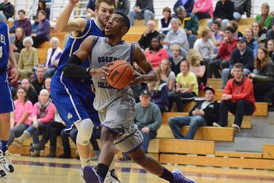 Basketball player lunging toward basket