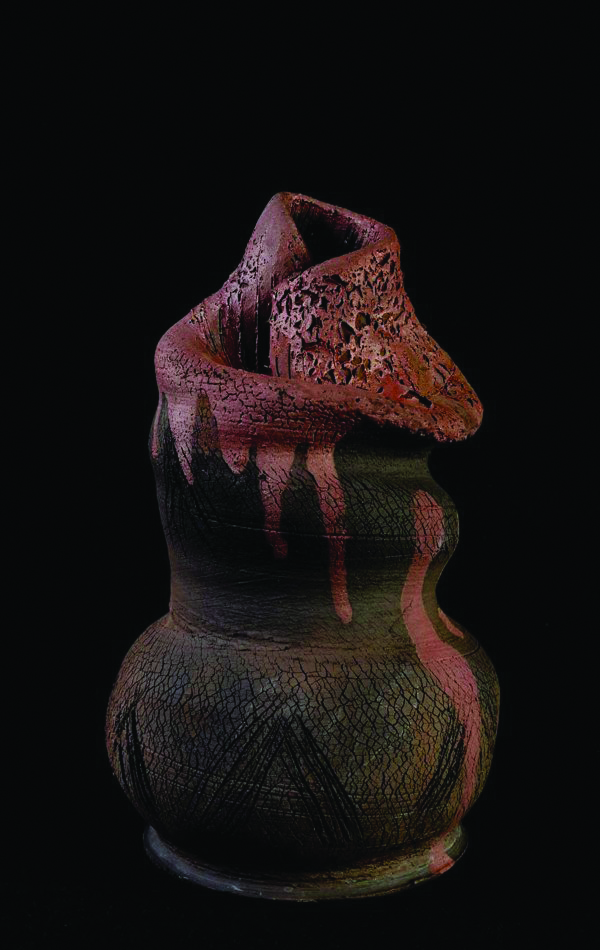 Image of one of Abi Abebe Tsigie's vase-like, brown and black ceramic structures
