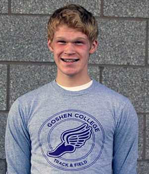 Portrait of Mitchell Brickson. He is wearing a Goshen College Track and Field shirt
