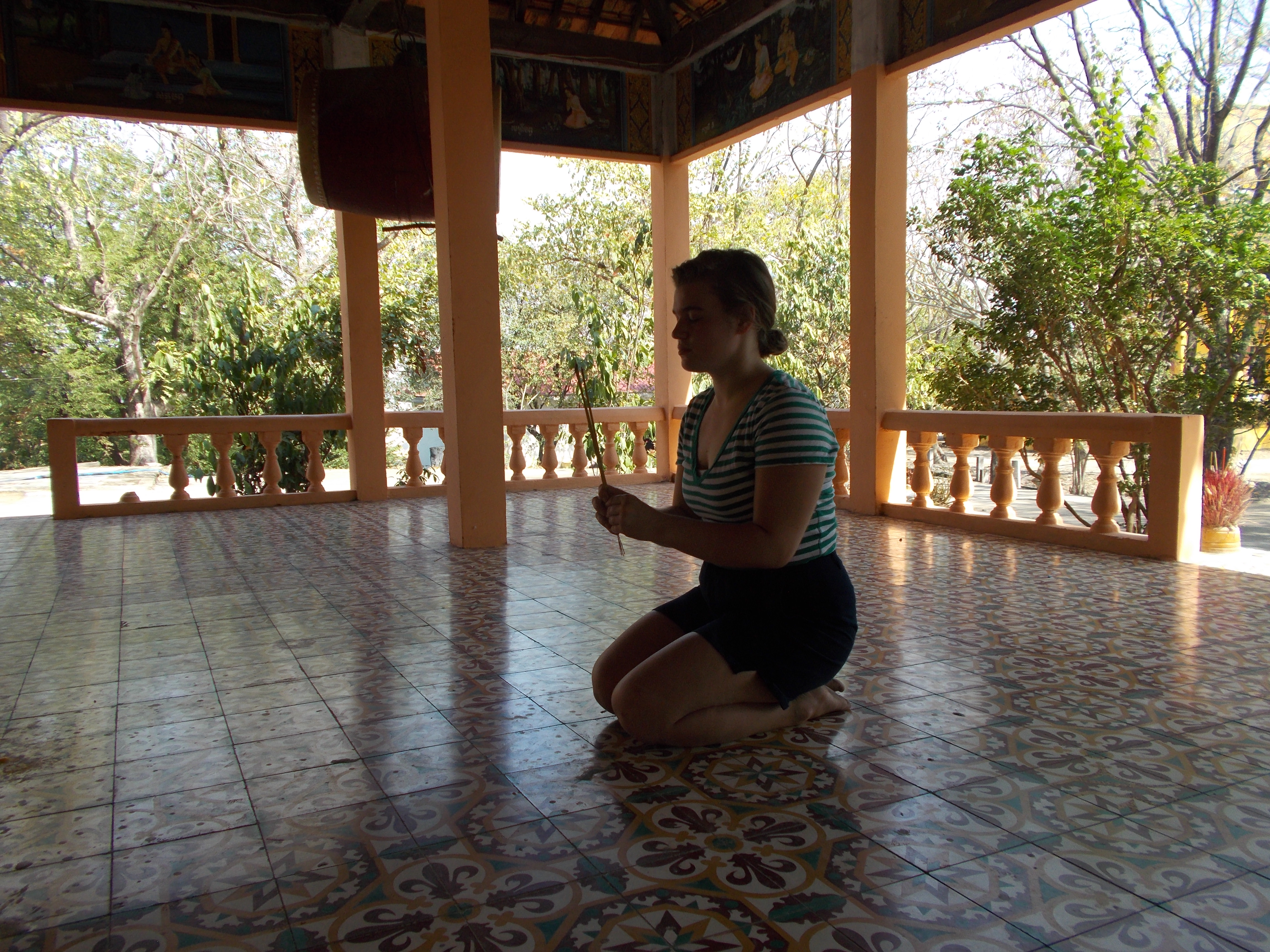 Sara Toews prays in a Buddhist temple
